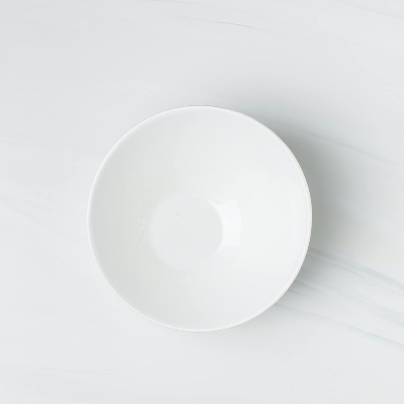 flatlay photography of white ceramic bowl